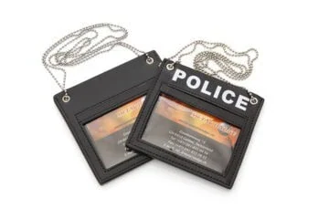 Leather for hanging around the neck with POLICE inscribed on one side